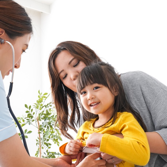 mother and child with doctor